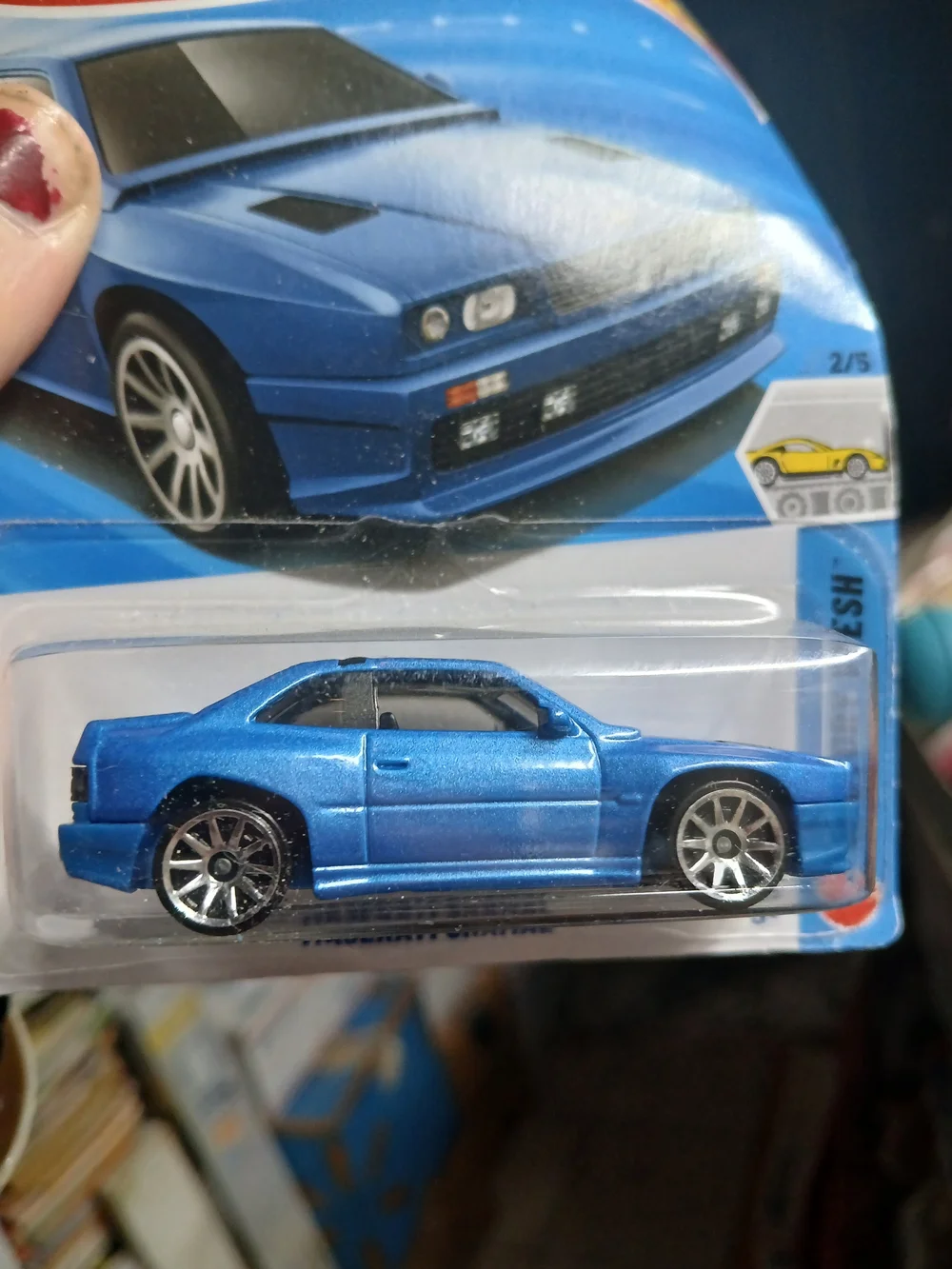blue Hot Wheels Maserati Shamal features a 1:64 scale die-cast body and belongs